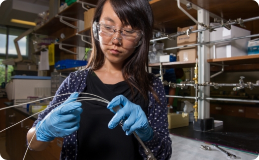 women wearing safety goggles working with wiring