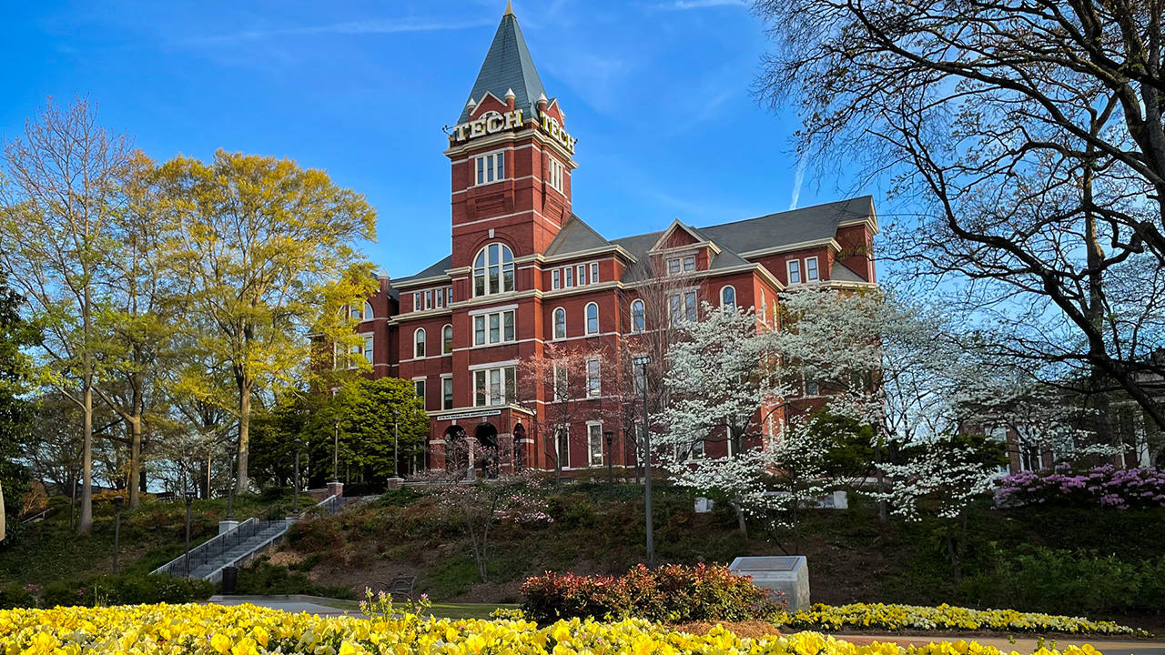 Georgia Tech's Tech Tower with flowers blooming in the foreground