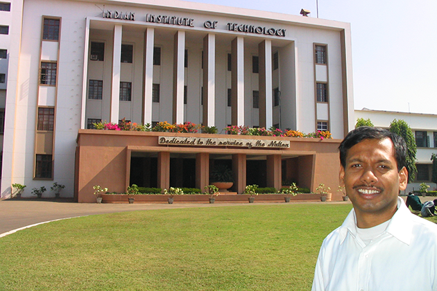 Man wearing a white shirt standing in front of a building on the Indian Institute of Technology campus