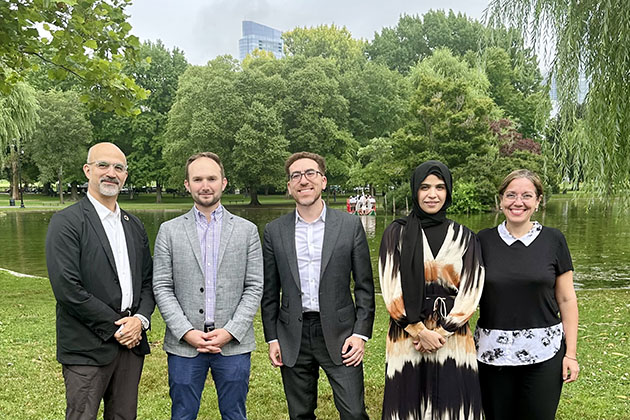 Group photo of Lamarr.AI's leadership team standing in a park.
