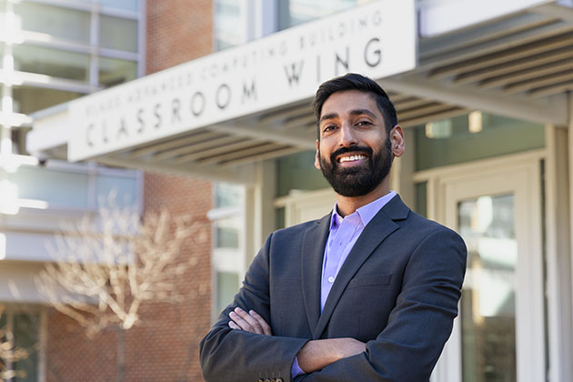 Alex Duncan headshot with the Klaus Building at Georgia Tech in the background.