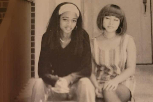 two females sitting on stairs and smiling