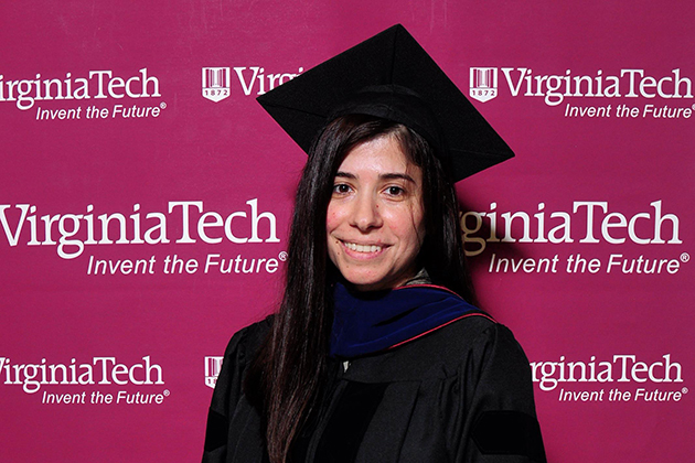 Zerrin Ondin-Fraser sitting on a bench in an academic building at Georgia Tech.