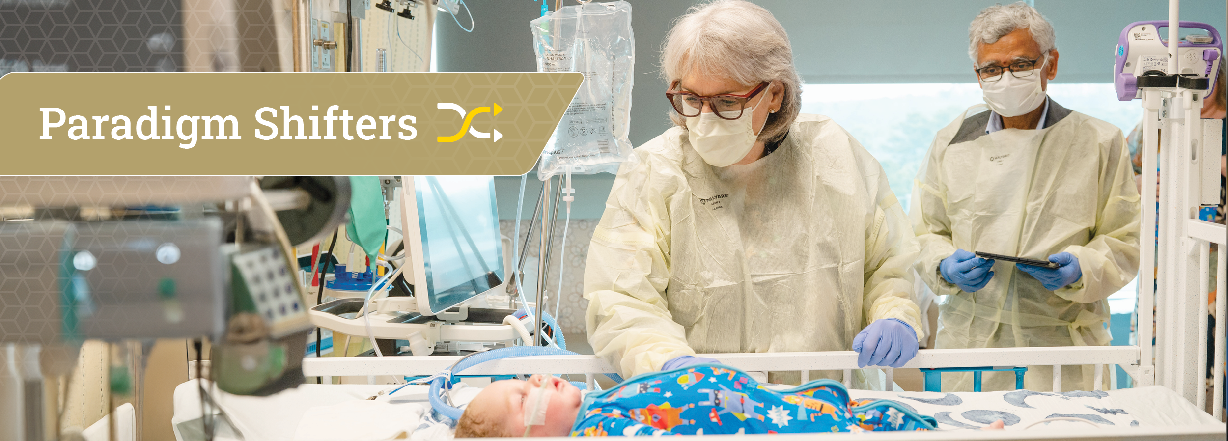 Two Doctors checking on an infant in a hospital bed. Words on image is the title Paradigm Shifters