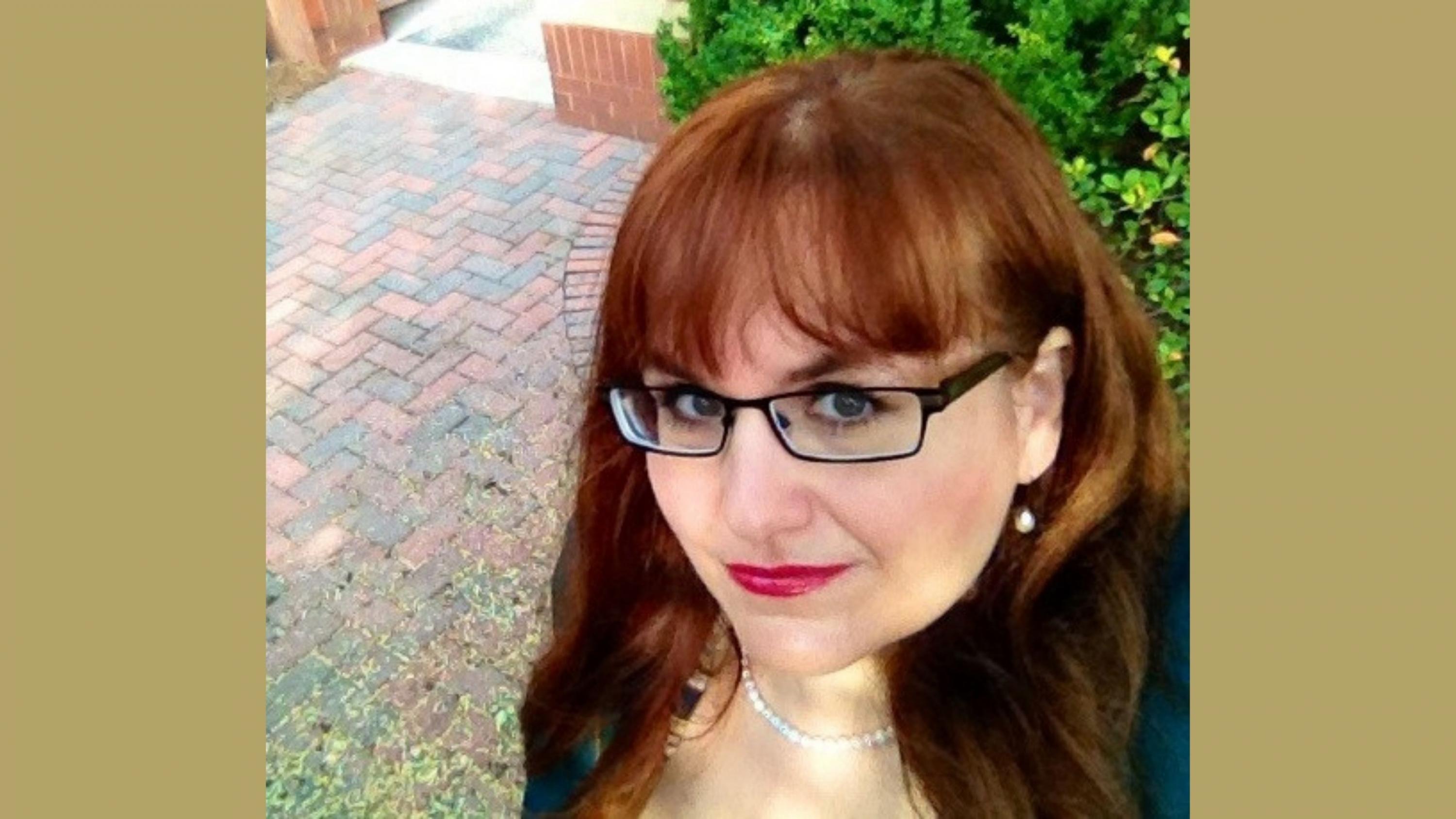 /Headshot%20of%20Margaret%20Kosal%20on%20a%20gold%20background.