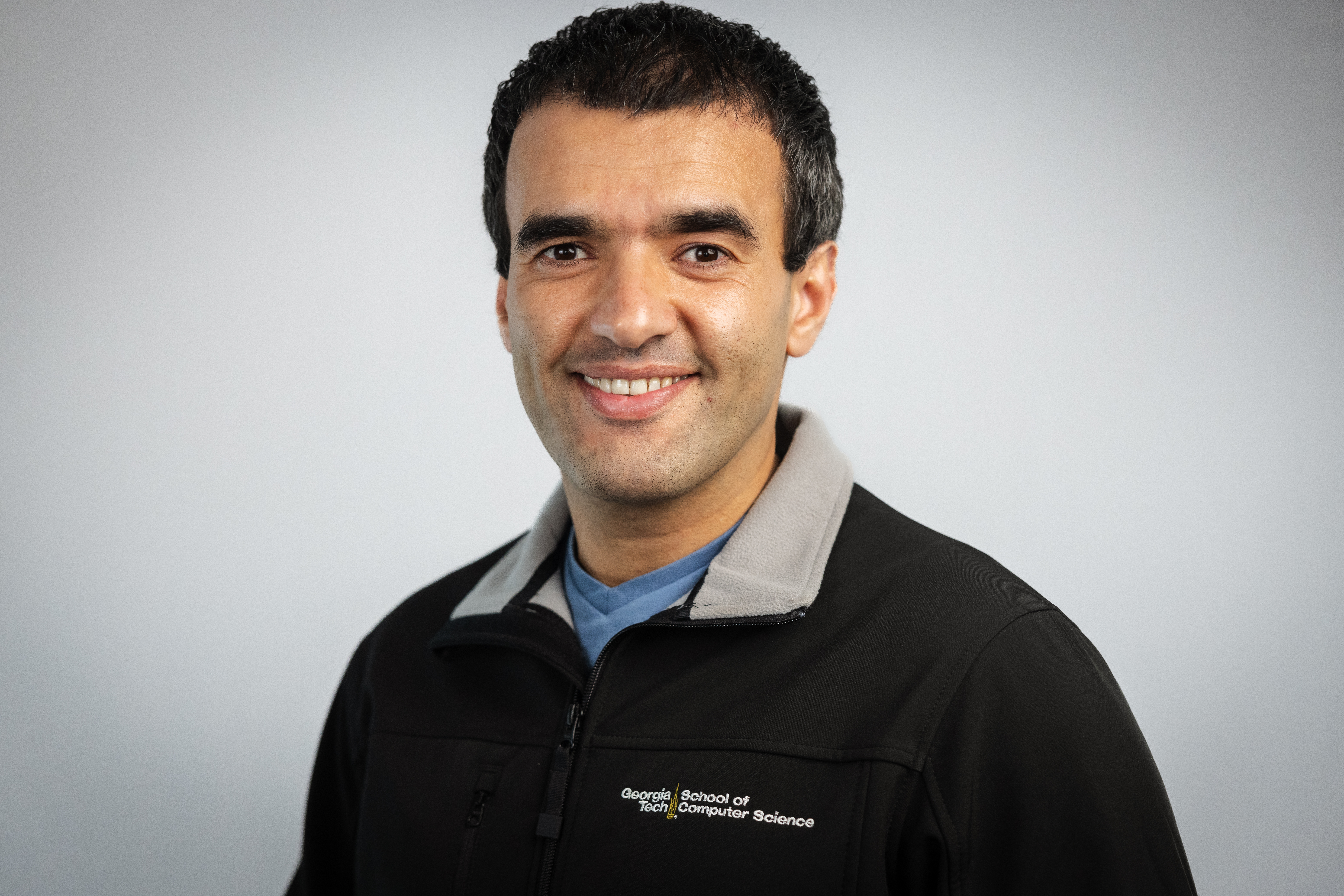 /man%20in%20a%20pullover%20smiling