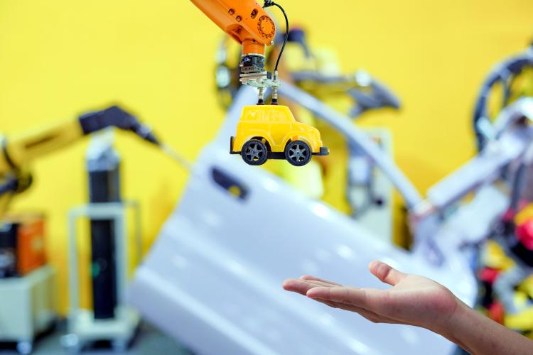 toy production into the hands of a person