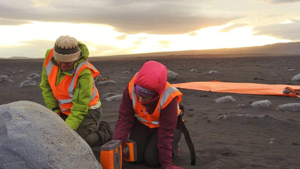 Students using handheld portable chemical analysis instrumentation analogous to those used on Mars.