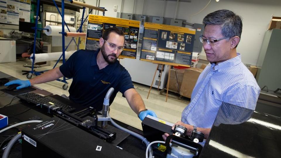 Jarod Weber, CHMI project manager, and Chuck Zhang, CHMI director,