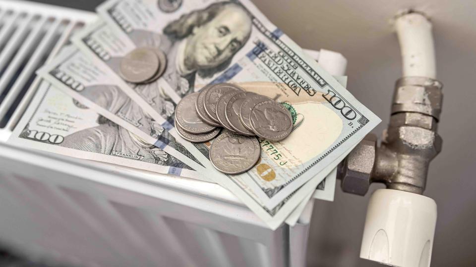 Image of US Dollar on Home Heating instrument depicting home heating costs