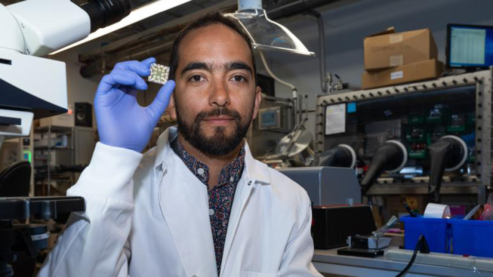 JuanpBablo CIrrea-Baena in a lab holding a chip