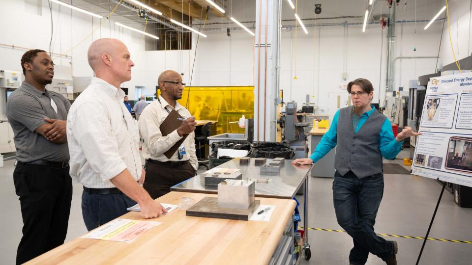 Industry attendees listen to technical AMPF presentation