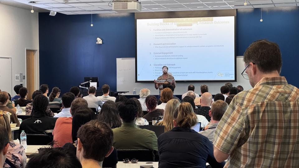 Executive Director Jud Ready presenting inside a room at the Marcus Nanotechnology Building for SRI's inaugural meeting.