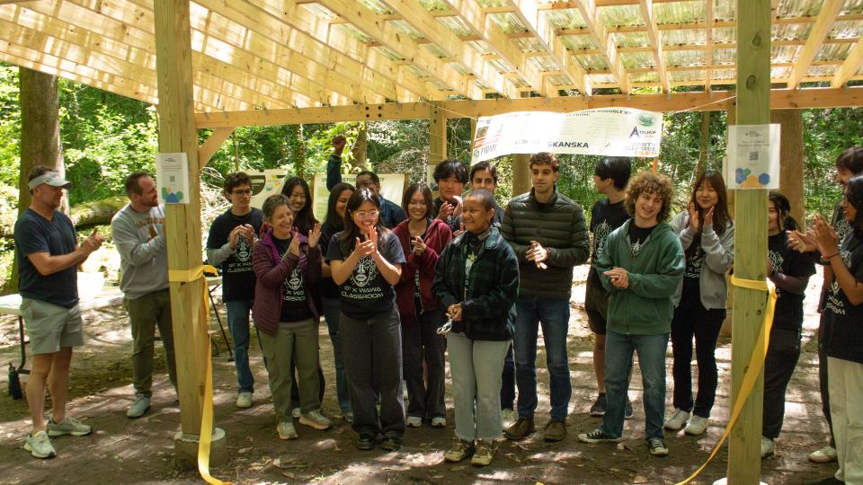 The Building for Equity and Sustainability undergraduate research class celebrates the opening of the outdoor classroom that they designed and built with the West Atlanta Watershed Alliance in Bush Mountain (April 14, 2025). 