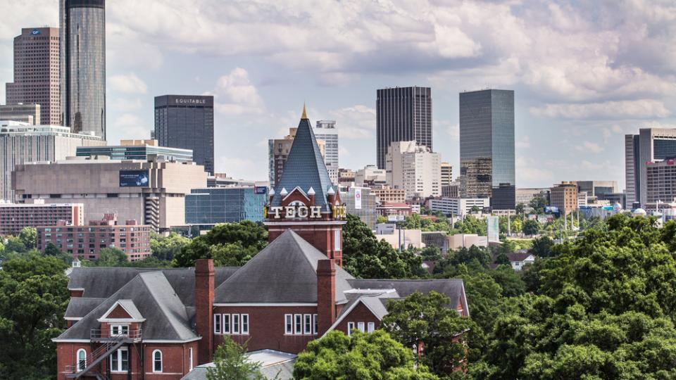 Tech Tower against the Atlanta skyline.