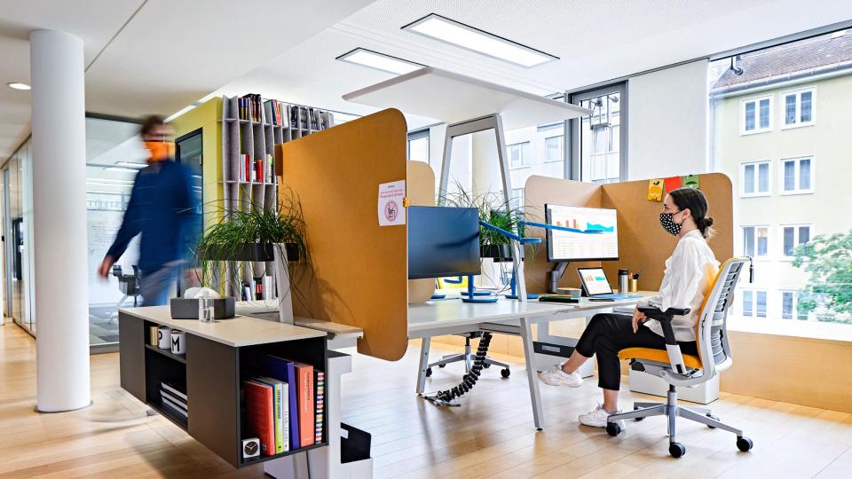 A furnished office environment with furniture designed by Steelcase.