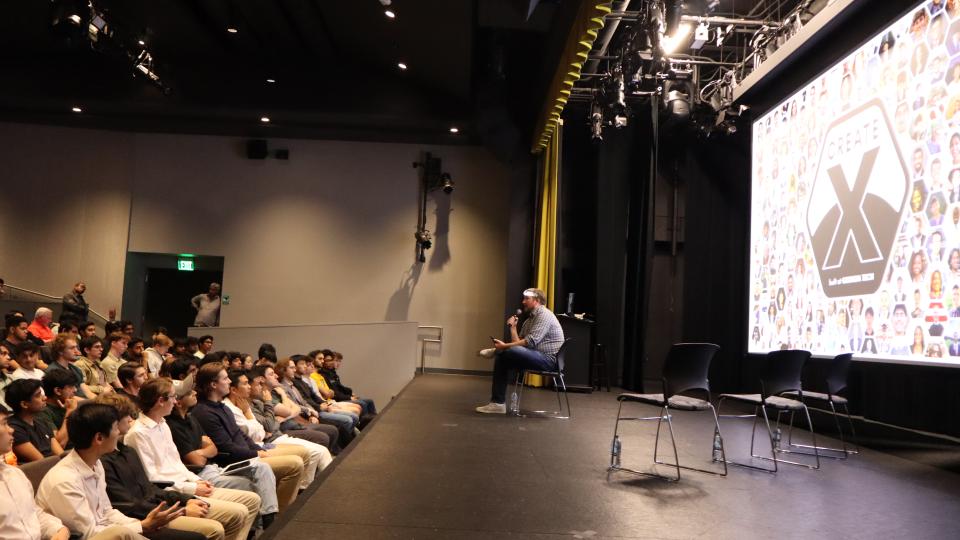 Brad Flora speaks to audience at YC@GT