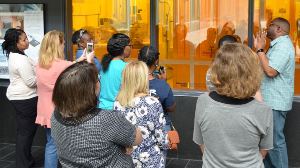 Mikkel Thomas speakers with K-12 Educators during a summer training