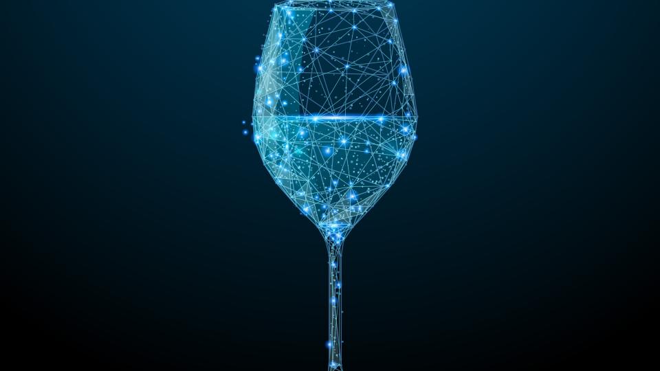 An abstract glass of wine consisting of points, lines, and shapes.