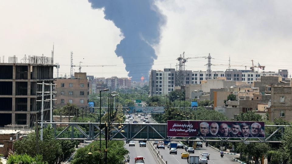 Heavy smoke and fire rise from an oil refinery in southern Tehran