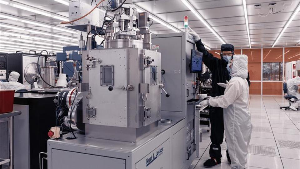 Student working with IMS staff in the fabrication cleanroom