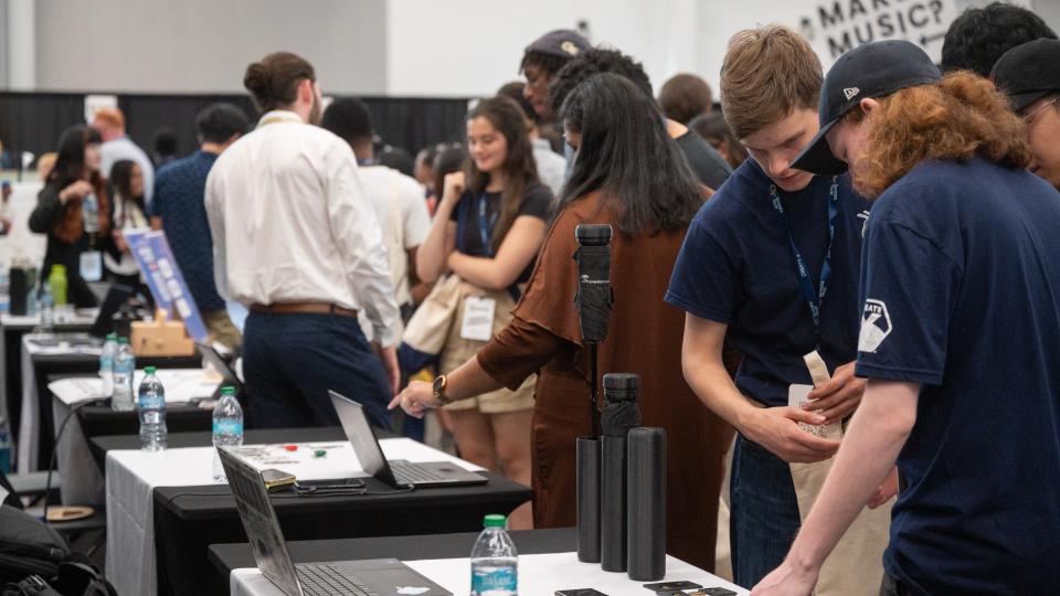 Crowds walk around Demo Day