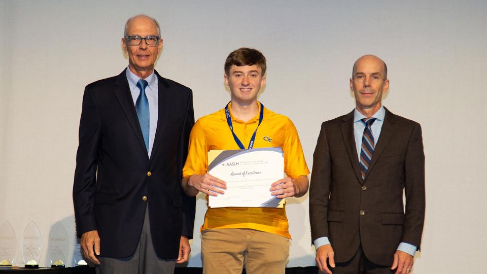 Georgia Tech student Bruce Minix accepts Award of Excellence from the American Association of State & Local History in September 2023.