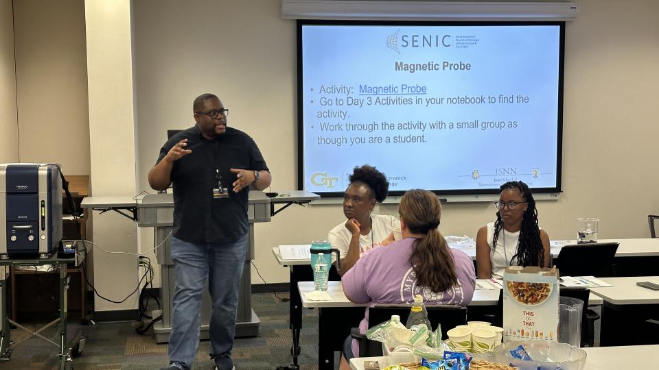 Mikkel Thomas speakers with K-12 Educators during a summer training