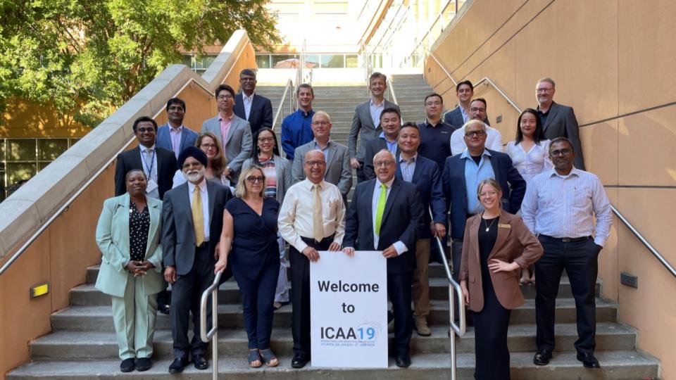 A group photo of several researchers at ICAA19.