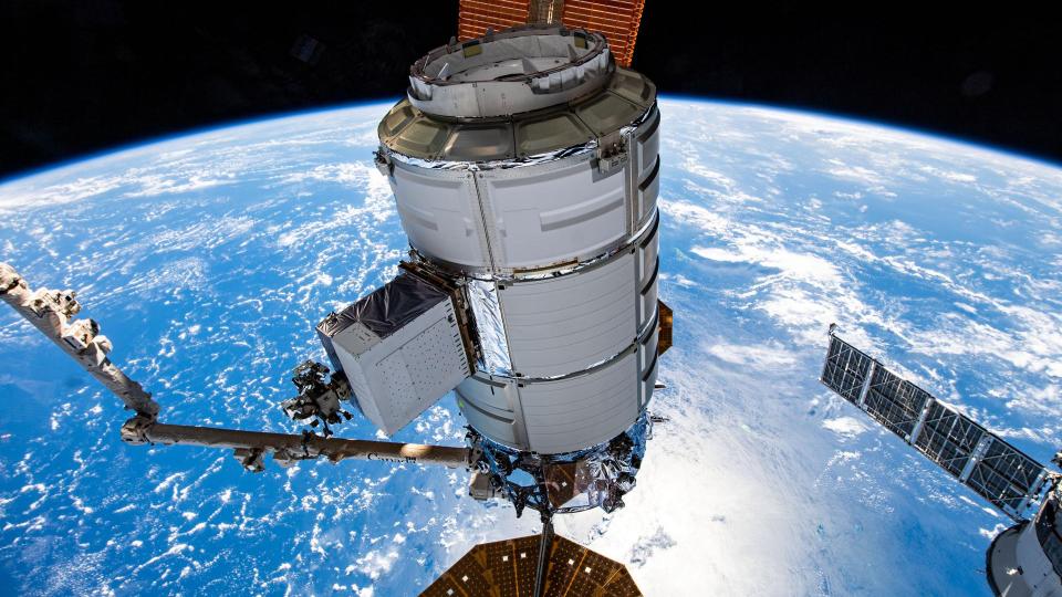 orthrop Grumman's Cygnus space freighter is pictured in the grip of the Canadarm2 robotic arm shortly after it was detached from the Unity module. The orbital complex was soaring 260 miles above the island archipelago of Seychelles in the Indian Ocean at the time of this photograph.