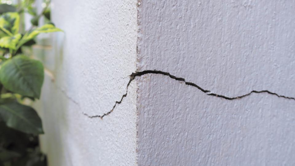 A crack in a building wall.