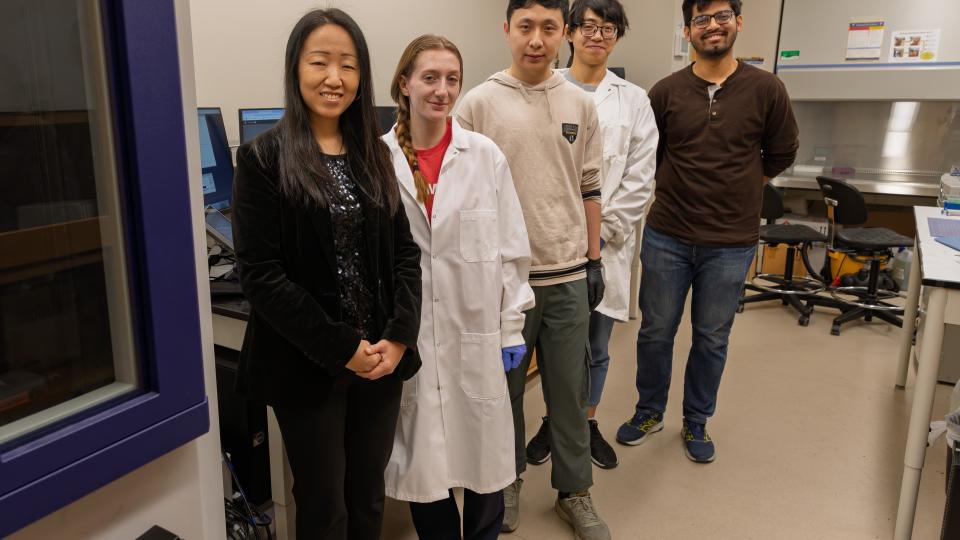 Yuhang Hu and students in the lab