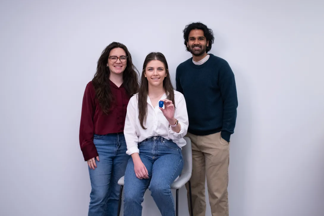 From left to right, Stridelink Founders Cassandra McIltrot , Marzeah “Zea” Khorramabadi, and Neel Narvekar. Khorramabadi is holding one of their sensors, a device like a watch.