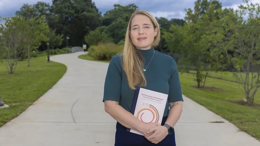Woman standing on walking path