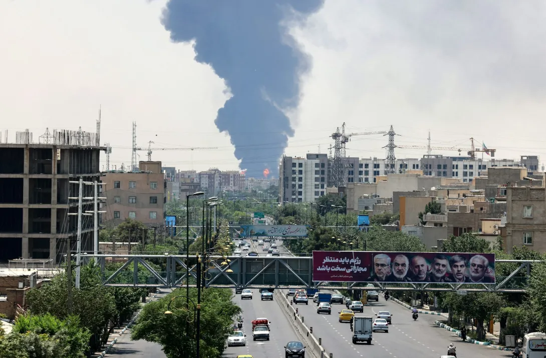 Heavy smoke and fire rise from an oil refinery in southern Tehran