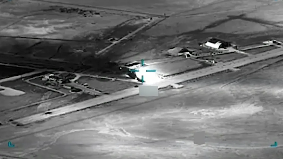  black and white aerial view of an airfield AI is helping U.S. forces find and choose targets in Iran, like this airfield. U.S. Central Command via AP