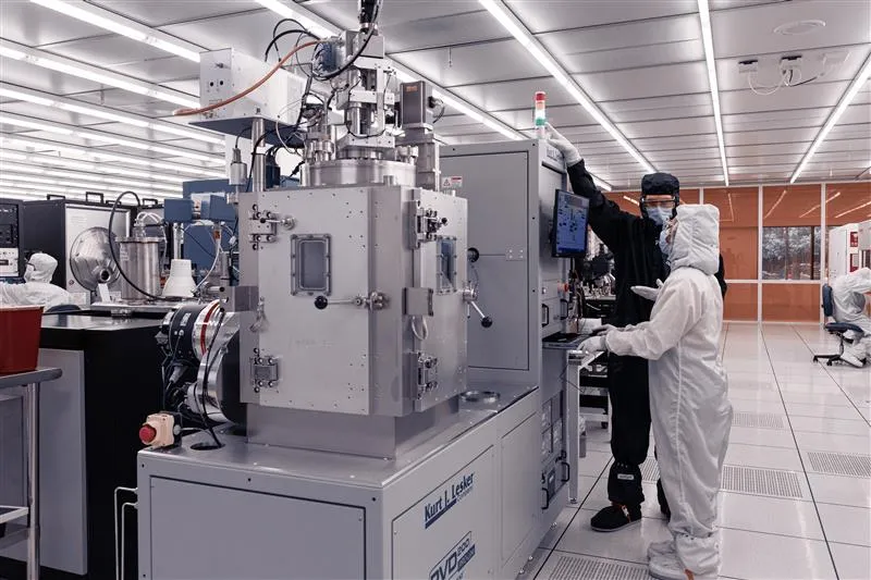 Student working with IMS staff in the fabrication cleanroom