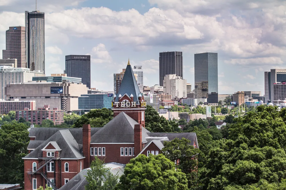 Tech Tower against the Atlanta skyline.