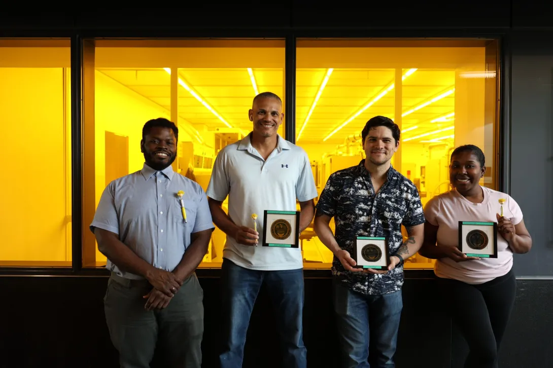 The four members of the 2025 MNCP with the wafers they made. 